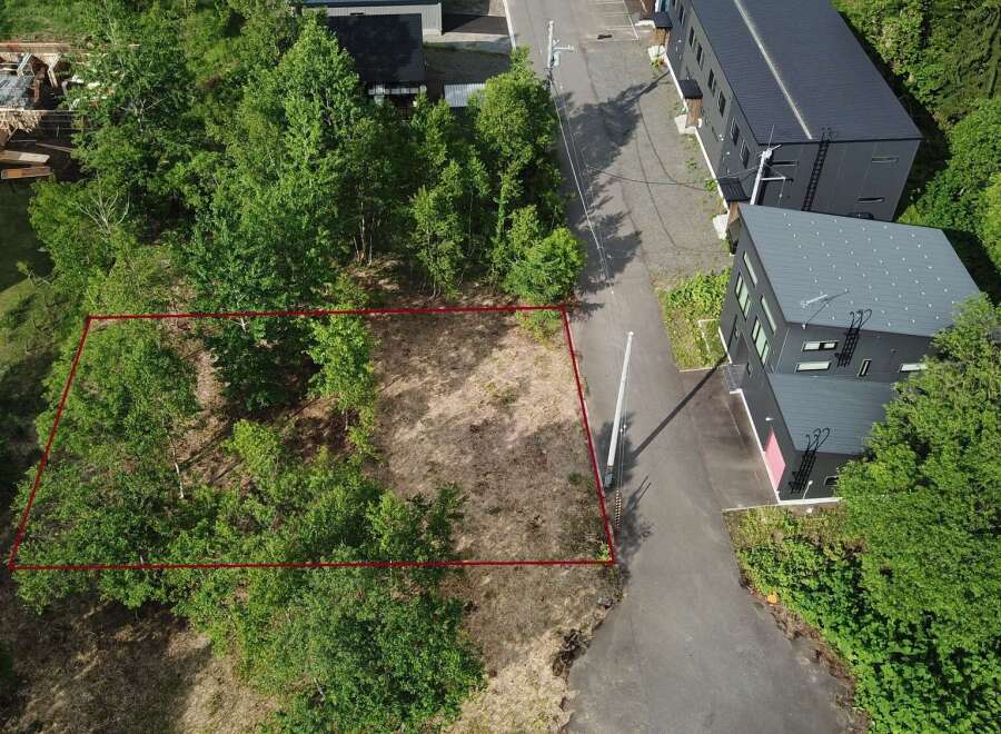 Discover this prime vacant land, outlined in red, offering a unique opportunity for development.
