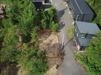Discover this prime vacant land, outlined in red, offering a unique opportunity for development.