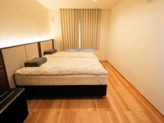 Experience comfort and style in this beautifully appointed hotel room, featuring two plush beds perfect for a restful night's sleep.