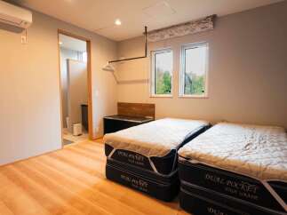 This spacious room features two comfortable beds, perfect for accommodating guests or family.