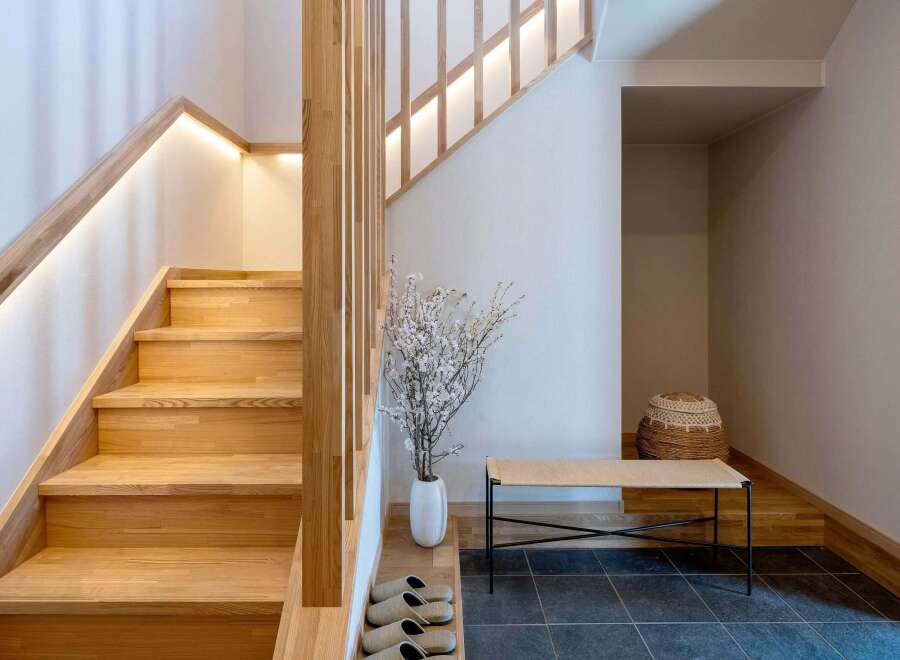 Experience modern living with this beautifully designed staircase, featuring warm wooden treads and integrated LED lighting for a sophisticated ambiance.