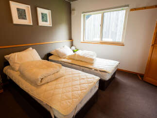 This cozy bedroom features two comfortable twin beds, perfect for accommodating guests or family.