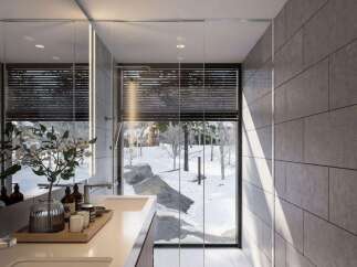 Experience luxury in this modern bathroom featuring a sleek double vanity and a spacious walk-in shower.