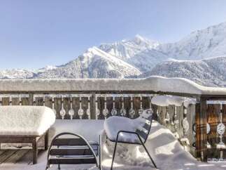 Experience breathtaking mountain views from this charming balcony, perfect for enjoying your morning coffee or evening wine.