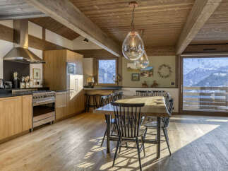 Experience luxurious mountain living in this stunning alpine kitchen and dining area.