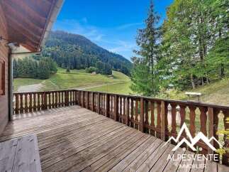 Enjoy breathtaking mountain views from this charming wooden deck, perfect for outdoor relaxation and entertaining.