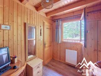 Discover this charming wooden cabin interior, perfect for a cozy retreat.