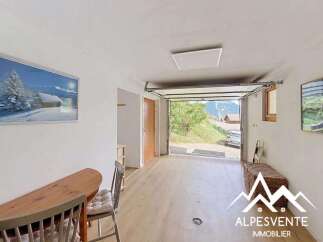 Discover this spacious garage with a stunning mountain view, perfect for parking vehicles or as additional storage.