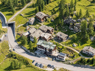 Discover this charming alpine village nestled amidst lush green mountains and dense pine forests.