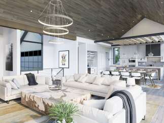 Experience modern luxury in this open-concept living space, featuring a vaulted wood-paneled ceiling and a striking multi-ring chandelier.