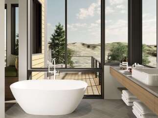 Experience luxurious relaxation in this stunning bathroom featuring a freestanding soaking tub with breathtaking panoramic views of the surrounding landscape.