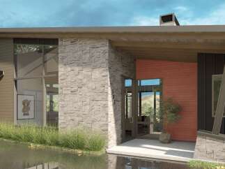 Experience modern luxury in this stunning architectural home, featuring a striking combination of stone and wood siding.
