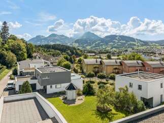 Discover modern living in this stunning property featuring sleek architecture and solar panels for sustainable energy.
