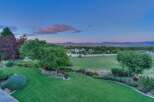 Experience serene country living with this stunning property featuring a meticulously manicured lawn and vibrant flower beds.