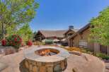 Experience luxurious outdoor living with this stunning patio featuring a built-in stone fire pit, perfect for cozy evenings.