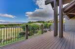 Enjoy breathtaking panoramic views from this expansive deck, perfect for entertaining or quiet relaxation.
