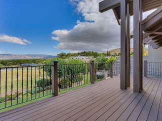 Enjoy breathtaking panoramic views from this expansive deck, perfect for entertaining or quiet relaxation.