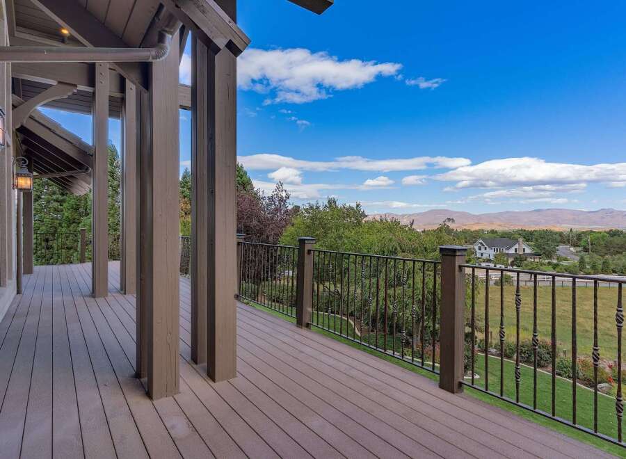 Enjoy breathtaking panoramic views from this expansive deck, perfect for entertaining or quiet relaxation.