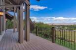 Enjoy breathtaking panoramic views from this expansive deck, perfect for entertaining or quiet relaxation.
