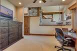 This spacious room offers a dedicated workspace with a large desk and comfortable office chair, perfect for productivity.