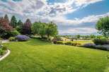 Experience the epitome of luxury living with this stunning property, boasting meticulously manicured lawns and vibrant floral arrangements.