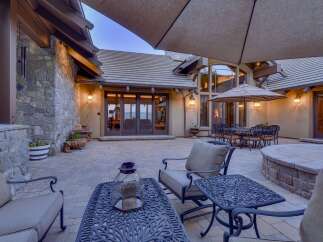 Experience luxurious outdoor living with this expansive patio, perfect for entertaining.