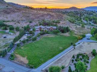 Discover this stunning estate nestled in a serene landscape, offering breathtaking sunset views.