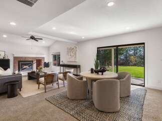 Experience seamless indoor-outdoor living in this beautifully appointed living and dining area.