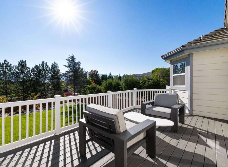 Enjoy breathtaking views from this spacious deck, perfect for outdoor entertaining or quiet relaxation.