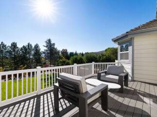 Enjoy breathtaking views from this spacious deck, perfect for outdoor entertaining or quiet relaxation.