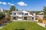 This stunning home boasts a spacious backyard with a meticulously manicured lawn, perfect for outdoor activities and entertaining.