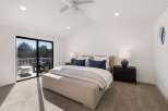 Experience luxury and comfort in this stunning bedroom featuring a king-sized bed adorned with plush pillows and a cozy duvet.