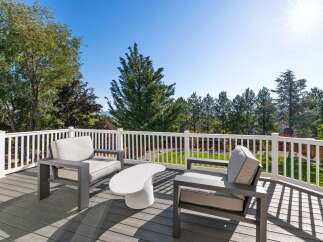 Enjoy breathtaking views from this expansive deck, perfect for outdoor entertaining or quiet relaxation.