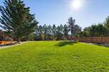 Enjoy the expansive, sun-drenched backyard, perfect for outdoor entertaining and recreation.