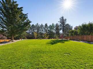Enjoy the expansive, sun-drenched backyard, perfect for outdoor entertaining and recreation.