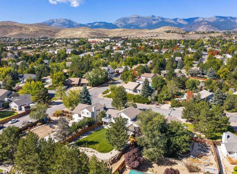 Discover this charming suburban neighborhood nestled against a backdrop of majestic mountains.