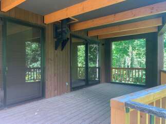 Enjoy the outdoors from this spacious deck, perfect for entertaining or relaxing.