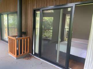 Experience seamless indoor-outdoor living with this property's expansive sliding glass doors, opening onto a private balcony.