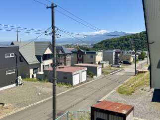 Discover this charming residential property nestled in a serene neighborhood with a picturesque mountain backdrop.