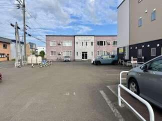 Discover this prime commercial property featuring a modern building with ample parking space.
