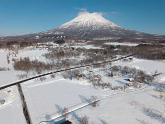 Experience the serene beauty of a winter wonderland with this stunning property nestled amidst snow-covered landscapes.