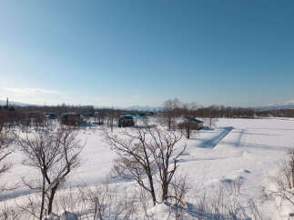 Experience the serene beauty of a winter wonderland with this picturesque property nestled amidst snow-covered landscapes.