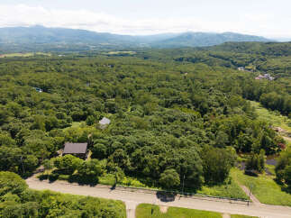 Discover this serene property nestled amidst lush greenery and rolling hills, offering a tranquil escape.