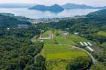 Discover this prime real estate opportunity with stunning panoramic views of a serene lake and distant mountains.