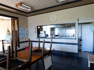 This dining area features a wooden table with chairs, perfect for family meals or gatherings.