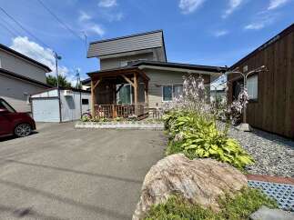 Discover this charming property featuring a covered wooden gazebo, perfect for outdoor relaxation and entertaining.