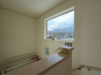 Enjoy breathtaking mountain views from this home's large, strategically placed window.