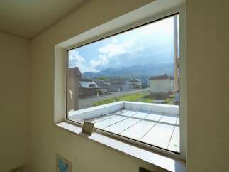 Enjoy breathtaking mountain views from this spacious window, offering a serene backdrop to your daily life.