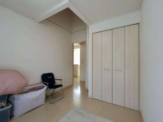 Discover this spacious room featuring a large built-in wardrobe, perfect for ample storage.