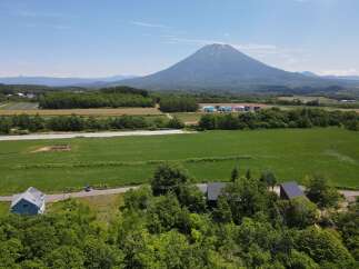 Discover this stunning property nestled amidst lush greenery, offering breathtaking views of a majestic mountain.